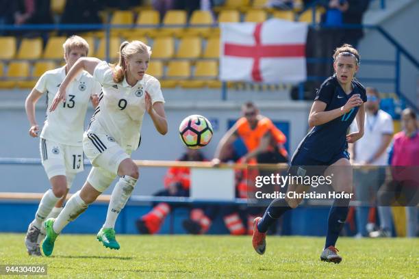 Anna-Lena Stolze of Germany challenges Georgia Eaton-Collins of England for the ball during the UEFA Women's Under19 Elite Round match between...