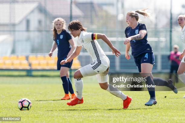 Lena Sophie Oberdorf of Germany challenges Jessica Jones of England for the ball during the UEFA Women's Under19 Elite Round match between England...