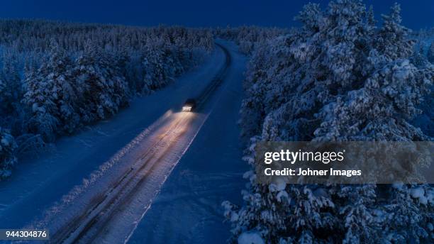 country road at winter - lappland aerial view stock-fotos und bilder
