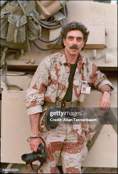 Portrait of American photojournalist Allan Tannenbaum after the liberation of Kuwait during the Gulf War, Safwan, Iraq, 1991.
