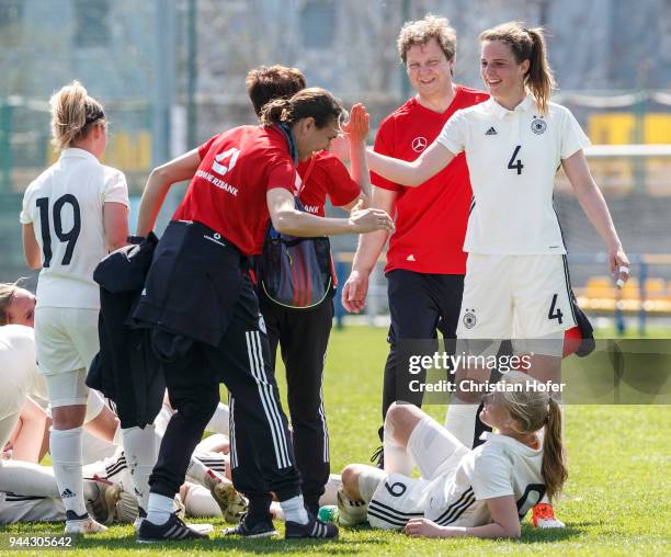 Players and staff members of Germany celebrate after winning the UEFA Women's Under19 Elite Round match between England and Germany on April 9, 2018...