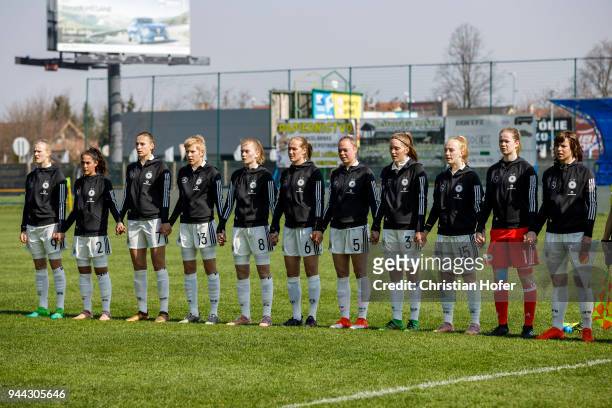 Players of Germany line up during the national anthem prior to the UEFA Women's Under19 Elite Round match between England and Germany on April 9,...