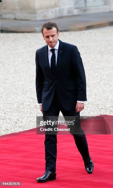 French President Emmanuel Macron returns at the Elysee Presidential Palace after his meeting with Morocco's King Mohammed VI on April 10, 2018 in...