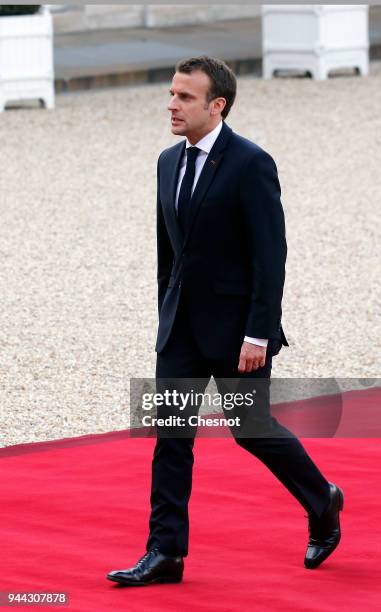 French President Emmanuel Macron returns at the Elysee Presidential Palace after his meeting with Morocco's King Mohammed VI on April 10, 2018 in...