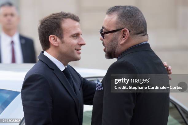 French President Emmanuel Macron escorts King Mohammed VI of Morocco as he leaves the Elysee Presidential Palace on April 10, 2018 in Paris, France....