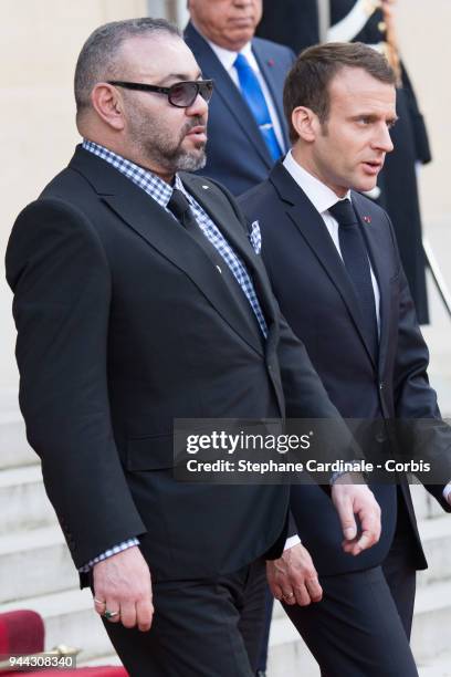 French President Emmanuel Macron escorts King Mohammed VI of Morocco as he leaves the Elysee Presidential Palace on April 10, 2018 in Paris, France....