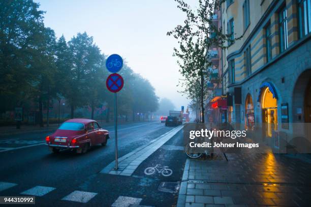 calm street in city during rain - abandoned city stock-fotos und bilder