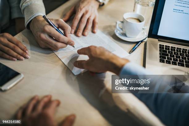 this is where you need to sign! - insurance contract stock pictures, royalty-free photos & images