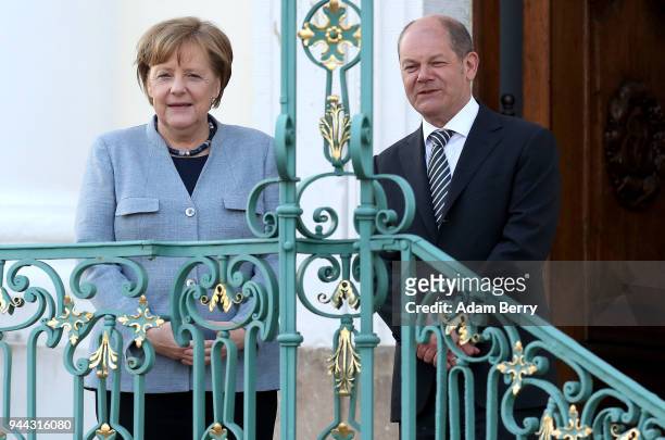 German Federal Chancellor Angela Merkel , and Finance Minister and Vice Chancellor Olaf Scholz attend a government retreat at Schloss Meseberg on...