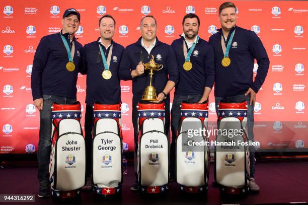 Gold medalist John Shuster, Tyler George, head coach Phill Drobnick, John Landsteiner and Matt Hamilton of the United States Men's Curling Team pose...