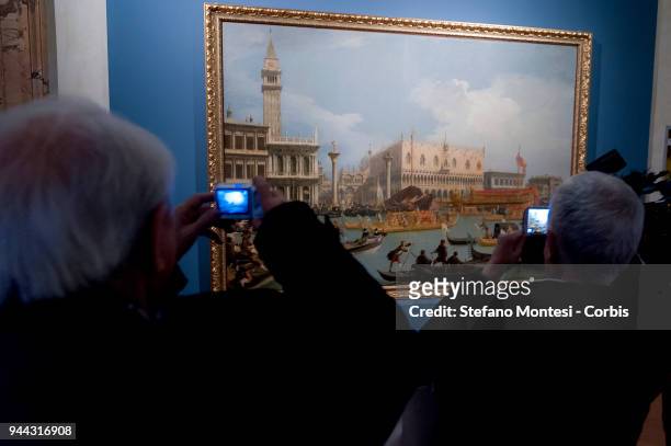 Visitors observes at the oil on canvas painting "The Bucintoro retuning to the Molo on the Ascension Day", by 18th century Venetian master Giovanni...