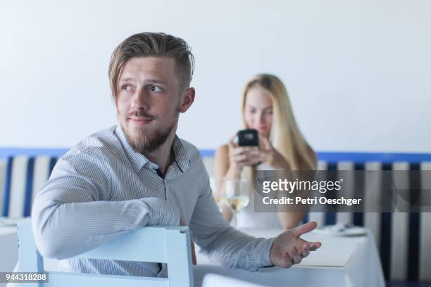 texting while on a date. - deko bad stock pictures, royalty-free photos & images