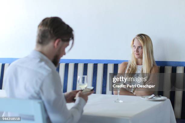 texting while on a date. - deko bad stock pictures, royalty-free photos & images