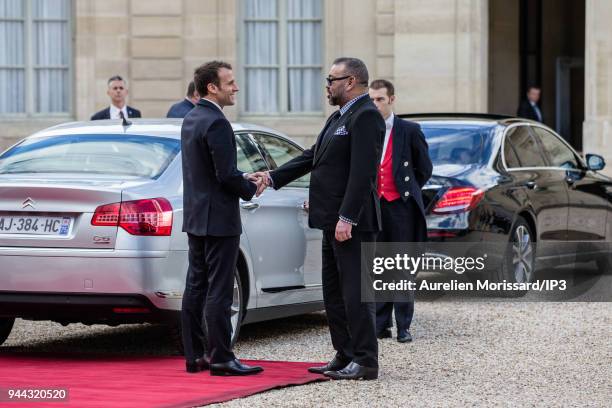 French President Emmanuel Macron escorts the King of Morocco Mohammed VI , after a meeting at Elysee Palace on April 10, 2018 in Paris, France....