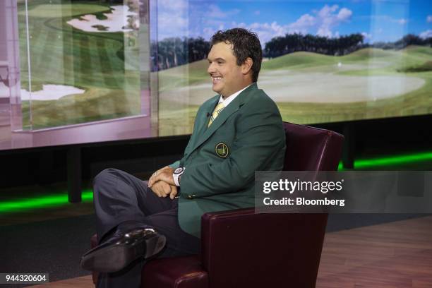 Professional golfer Patrick Reed smiles during a Bloomberg Television interview in New York, U.S., on Tuesday, April 10, 2018. Reed talked about...