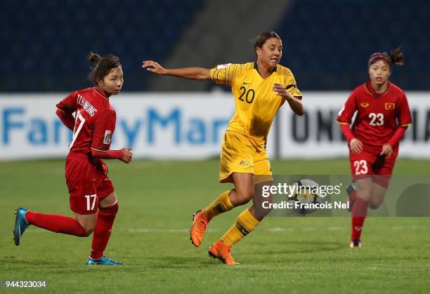 Samantha May Kerr of Australia battles for the ball with Tran Thi Hong Nhung and Pham Hoang Quynh of Vietnam during the AFC Women's Asian Cup Group B...