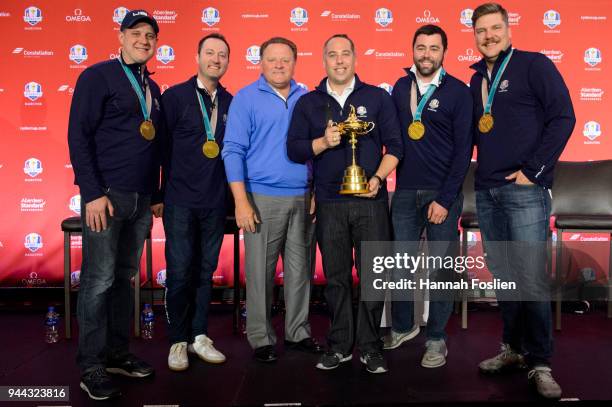 President, PGA of America, Paul Levy poses for a photo with the Olympic gold medal winning Men's Curling Team at the 2028 Ryder Cup location...