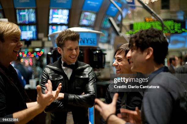 Andrew Lee, Alexander Noyes, Michael Bruno, and Jason Rosen of Honor Society pose at the New York Stock Exchange on December 14, 2009 in New York...