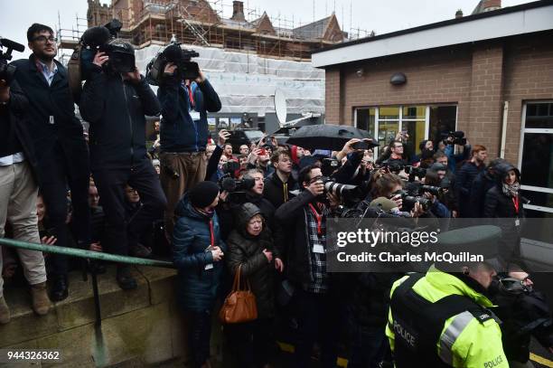 Large crowd gathers to watch former President Bill Clinton arrive at an event to mark the 20th anniversary of the Good Friday Agreement at Queens...