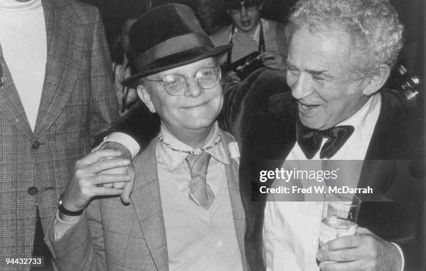 American authors Truman Capote and Norman Mailer share a laugh at a party, New York, New York, March 21, 1978. The party was held in honor of the...