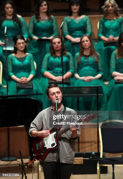 In this handout photo provided by Press Eye, A musician performs as a ceremony is held in the historic setting of the Ulster Hall to confer the...