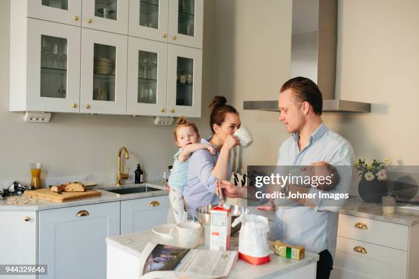 family in kitchen - family chaos stock pictures, royalty-free photos & images