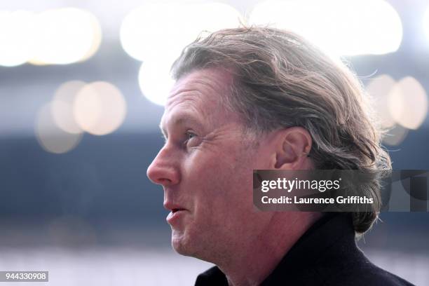 Steve McManaman, former Liverpool and Manchester City player looks on prior to the UEFA Champions League Quarter Final Second Leg match between...