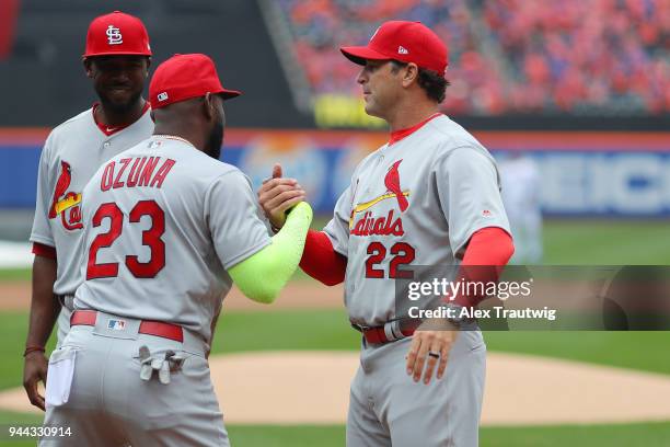 Marcell Ozuna of the St. Louis Cardinals hugs Manager Mike Matheny of the St. Louis Cardinals during player introductions prior to the the game...
