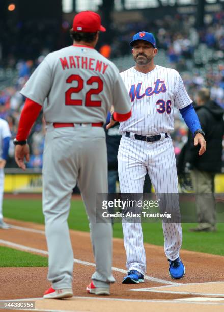 Managers Mike Matheny of the St. Louis Cardinals and Mickey Callaway of the New York Mets shake hands during during player introductions prior to the...