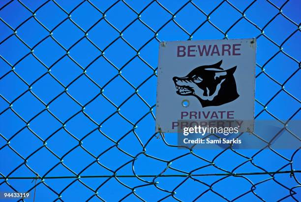 private property warning sign on fence - beware of dog stock pictures, royalty-free photos & images