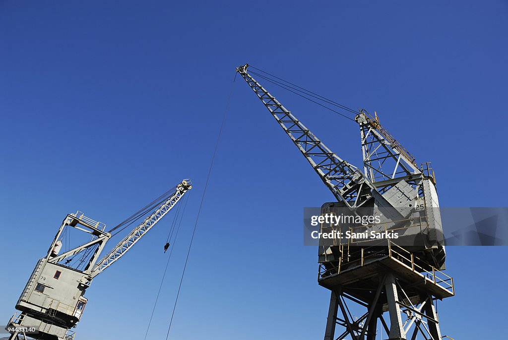 Two cranes at harbor