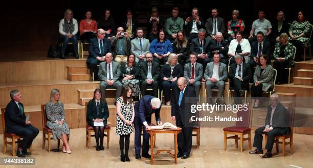In this handout photo provided by Press Eye, former U.S. President Bill Clinton and Senator George J. Mitchell attend a ceremony held in the historic...