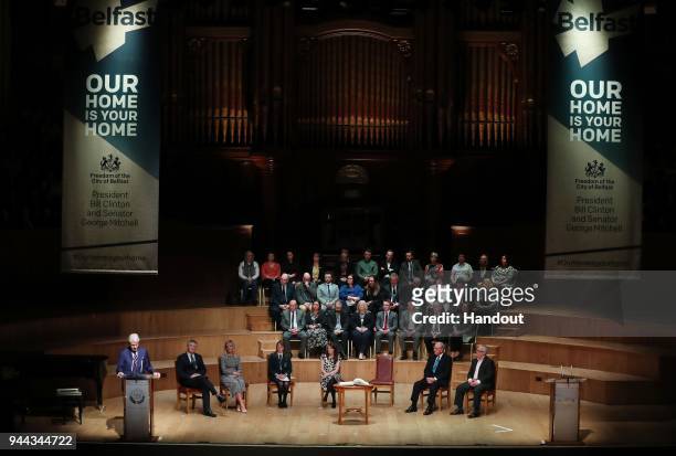 In this handout photo provided by Press Eye, former U.S. President Bill Clinton attends a ceremony held in the historic setting of the Ulster Hall to...