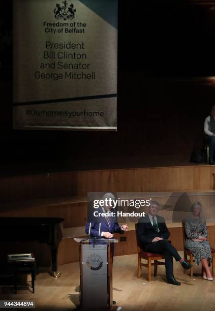 In this handout photo provided by Press Eye, former U.S. President Bill Clinton attends a ceremony held in the historic setting of the Ulster Hall to...