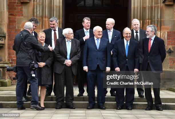 Key players in the peace agreement pose for a group photograph as they attend an event to mark the 20th anniversary of the Good Friday Agreement...