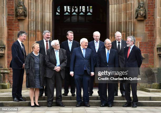 Key players in the peace agreement pose for a group photograph as they attend an event to mark the 20th anniversary of the Good Friday Agreement...