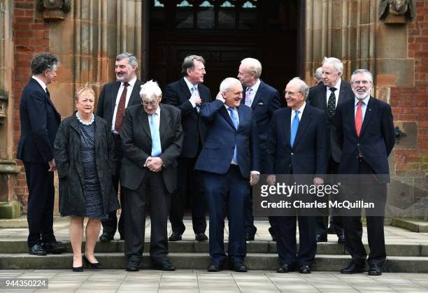 Key players in the peace agreement pose for a group photograph as they attend an event to mark the 20th anniversary of the Good Friday Agreement...