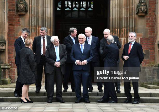 Key players in the peace agreement pose for a group photograph as they attend an event to mark the 20th anniversary of the Good Friday Agreement...