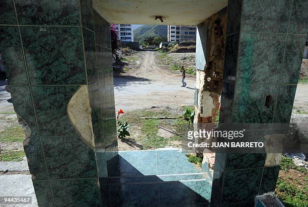 View of the destroyed facade of a house in the coastal region La Guaira, state of Vargas, 50 km from Caracas, on December 11, 2009. Los Corales was...