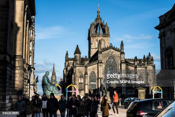 David Hume Statue and St. Giles Cathedral in background. Edinburgh is a city with a population of 500,000 in 2017, it the capital city of Scotland....