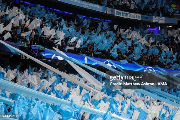 General view of fans of Manchester City at The Etihad Stadium, home stadium of Manchester City as they hold up blue and white banners prior to the...