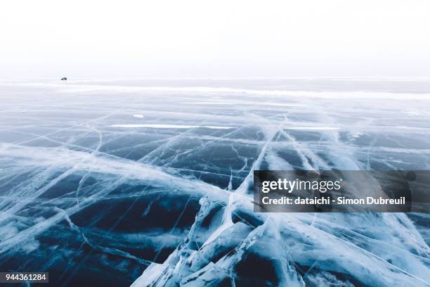 car driving on lake baikal - frozen lake stock pictures, royalty-free photos & images