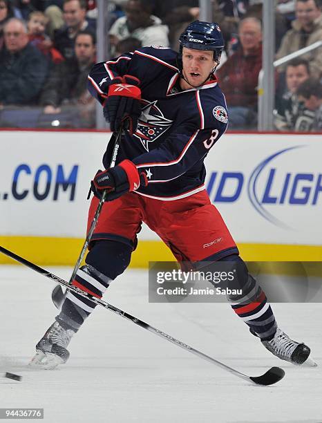 Defenseman Marc Methot of the Columbus Blue Jackets skates with the puck against the Anaheim Ducks on December 12, 2009 at Nationwide Arena in...