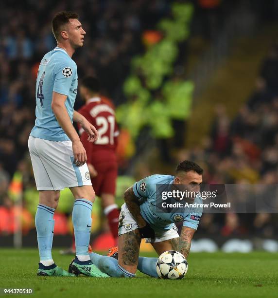 Sadio Mane of Liverpool brings down Nicolas Otamendi of Mancity and gets booked during the UEFA Champions League Quarter Final Second Leg match...