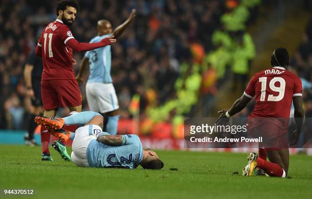 Sadio Mane of Liverpool brings down Nicolas Otamendi of Mancity and gets booked during the UEFA Champions League Quarter Final Second Leg match...