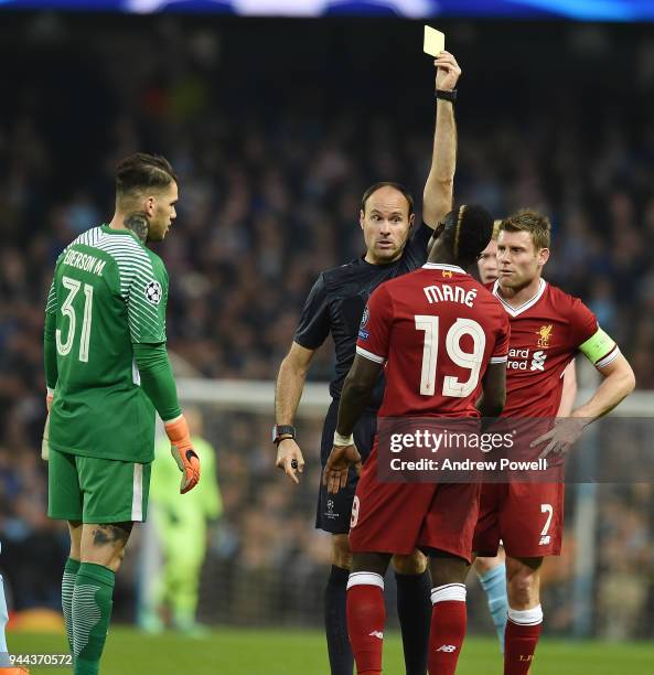 Sadio Mane of Liverpool brings down Nicolas Otamendi of Mancity and gets booked during the UEFA Champions League Quarter Final Second Leg match...