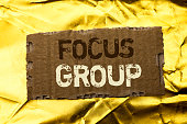 Word writing text Focus Group. Business concept for Interactive Concentrating Planning Conference Survey Focused written on tear Cardboard Piece on the Golden textured background.