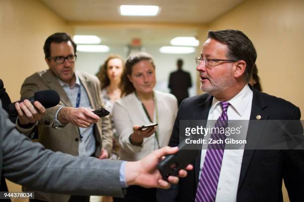 Sen. Gary Peters speaks to reporters in the Senate Basement on Capitol Hill on April 10, 2018 in Washington, DC. Senate lawmakers addressed the media...