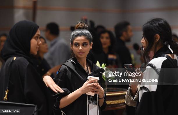 Women attend the opening ceremony of Arab Fashion Week, on April 10 at Ritz Carlton hotel in Riyadh.