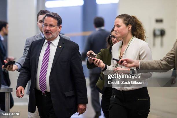 Sen. Gary Peters speaks to reporters in the Senate Basement on Capitol Hill on April 10, 2018 in Washington, DC. Senate lawmakers addressed the media...